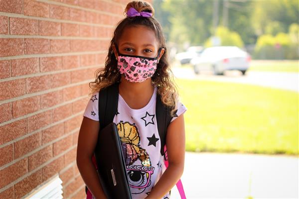 student smiles on first day of school